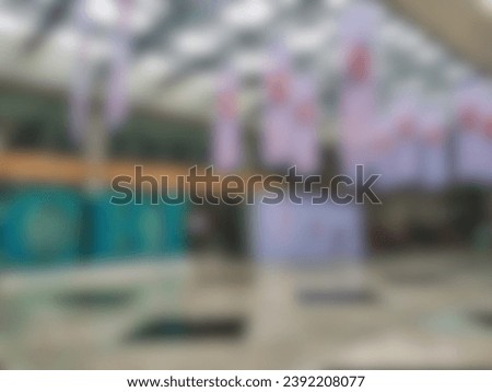 blurred background of a hanging banner installed at an exhibition in a building for event promotion