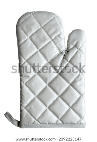 Grey kitchen glove, heat protection and safety isolated on white. Royalty-Free Stock Photo #2392225147