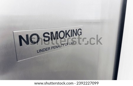 red and white no smoking sign on wall, symbolizing smoke-free zone and health awareness