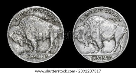 Reverse of U.S. Indian Head (Buffalo) nickel 5¢ coin Var. 1 with bison on mound (early 1913) compared side-by-side with Var. 2 with bison on flat ground (mid-1913 to 1938). Isolated on black. Royalty-Free Stock Photo #2392237317