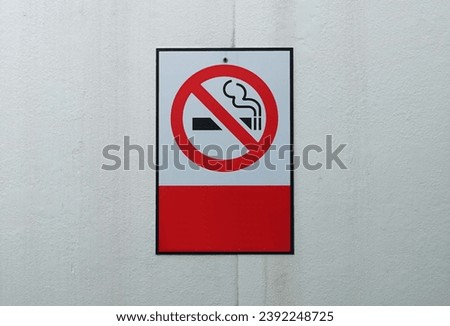No smoking sign on white wall background, warnning concepts.