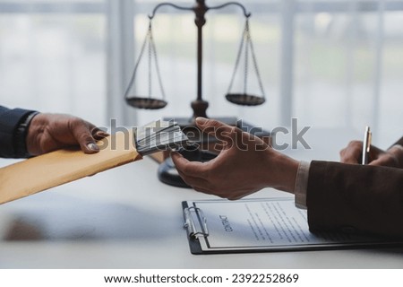 Government tax officials, legal advisers taking bribes of citizens wrapped in brown envelopes. Opening the annual tax evasion, the concept of bribing tax evader officials. Royalty-Free Stock Photo #2392252869