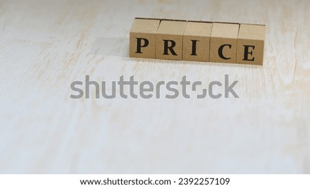 "Price" written on wooden blocks, business and communication concept