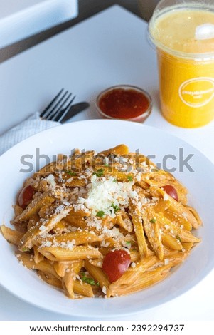 This is a picture of pasta with pineapple juice