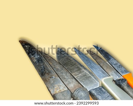 pictures of several knife blades of various sizes, shapes and colors with a light brown background