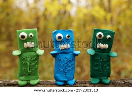 Zombie figures with funny faces. Halloween decorations.