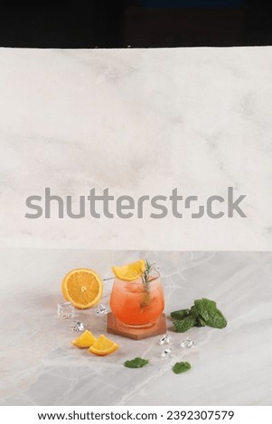 fruit punch in a glasses garnished with orange slices and lemon and pinapple