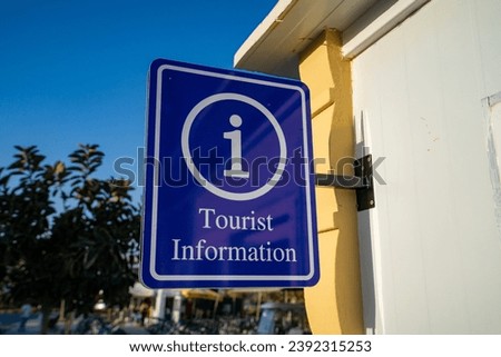 Blue Tourist Information sign outdoor.