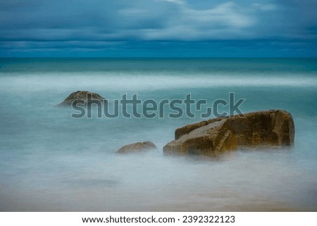 Slow shutter speed creating a creamy look of the water and the rock