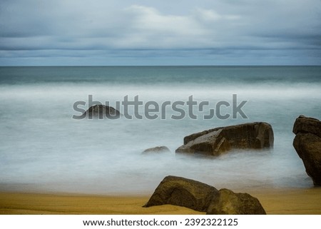 Slow shutter speed creating a creamy look of the water and the rock