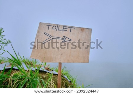 Picture of toilet direction sign