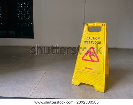 Indonesia, Makassar - 09 November 2023. "Beware of Slippery Floor" notice sign in the office.