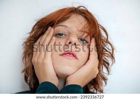 beautiful teenage girl with red anime hair on a light background