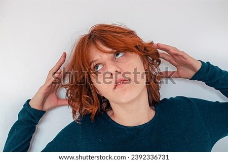portrait of a beautiful anime girl with red hair wearing glasses on a light background