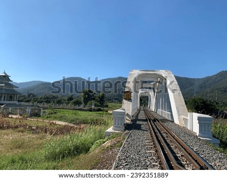 mountain view and White bridge in Lamphun Province, Thailand.