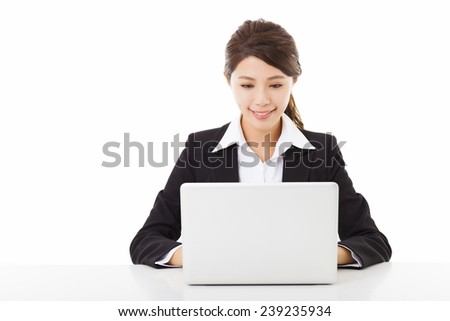 smiling young business woman working with  laptop 