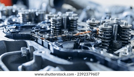 Engine diesel fuel injection nozzle of industrial truck. Content for repair factory station for fix service. Royalty-Free Stock Photo #2392379607