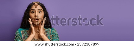 attractive shocked indian woman posing with hands near face looking at camera surprisedly, banner