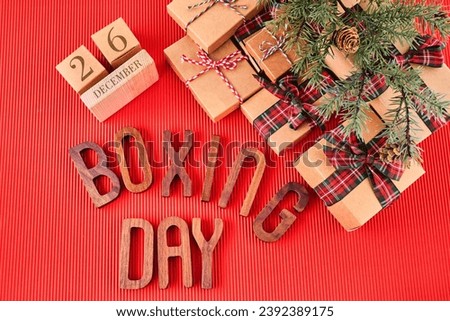 Boxing Day Concept. Different kinds of gift boxes on red background