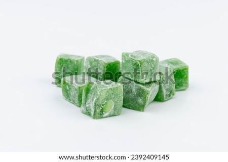Traditional Turkish delight isolated on white background.  Sweet delicious lukum color.