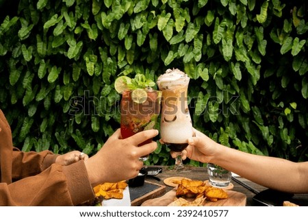 This picture encapsulates the diverse pleasures of sipping a luscious coffee milkshake and relishing the invigorating notes of a classic cocktail.