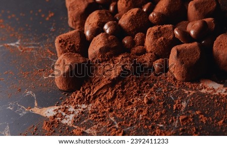 Chocolate Truffles: Smooth and creamy chocolate ganache rolled into bite-sized balls and coated in cocoa powder or nuts. Royalty-Free Stock Photo #2392411233