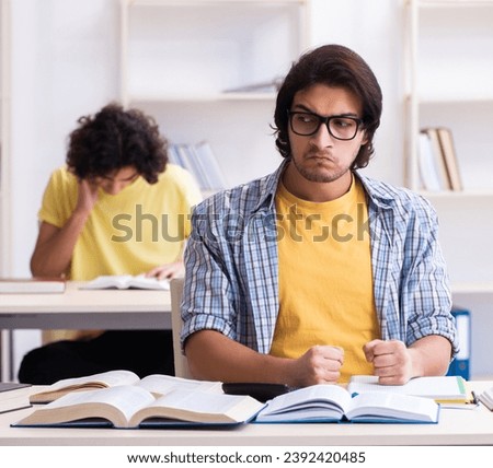 Two male students in the classroom Royalty-Free Stock Photo #2392420485