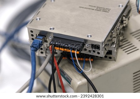 Network cable connected to a data acquisition unit. Royalty-Free Stock Photo #2392428301