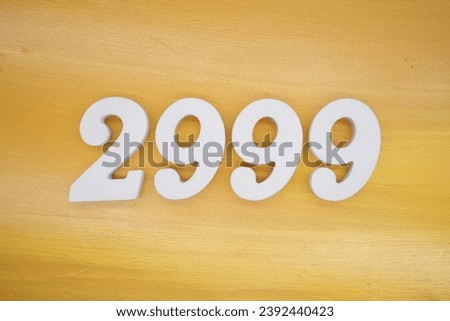 The golden yellow painted wood panel for the background, number 2999, is made from white painted wood.