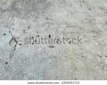 bullet holes in the concrete.