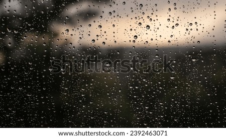 Raindrops on the window, blurred background, rainy day