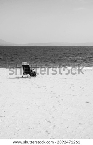 chair on the sand, on the seashore