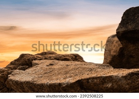 Rock Stone Podium on sunset Sky Background, Rock podium outdoor with orange sunlight sky well space for Display Product banner background 