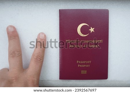 Republic of Türkiye passport, hand making freedom sign