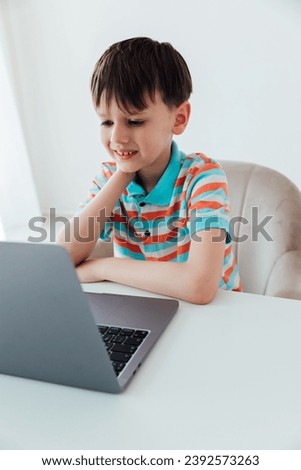 Boy doing online learning with laptop