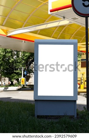 Empty billboard at a yellow gas station. Mock-up.