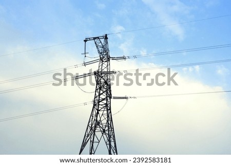 Electric power transmission against blue sky background 