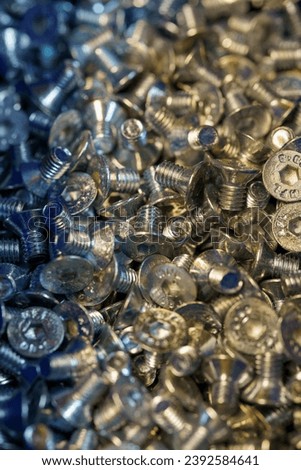 Fasteners, stainless steel nuts and bolts on background