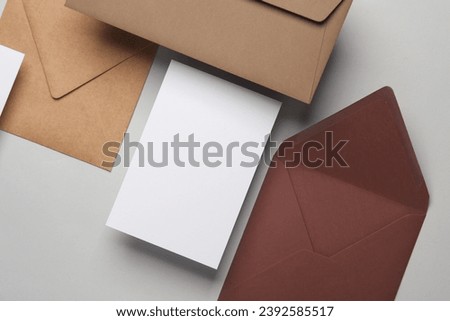 Floating envelopes and cards on gray background with shadow. Minimalism, modern business still life, creative layout