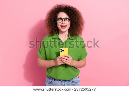 Photo of astonished lovely girl dressed green trendy clothes rejoice black friday sale apple iphone isolated on pink color background