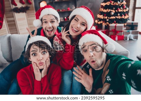 Portrait of crazy excited buddies make selfie show v-sign horns eye wink pouted lips new year event apartment indoors