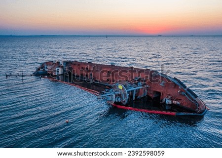 Seaquake Aftermath: Tanker Upended in the Roar of the Storm Royalty-Free Stock Photo #2392598059