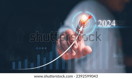 Business target goals and achievement in 2024, Businessman touching at target icon at 2024 on the top of increase arrow graph corporate future growth, Plans and visions for success in next year.