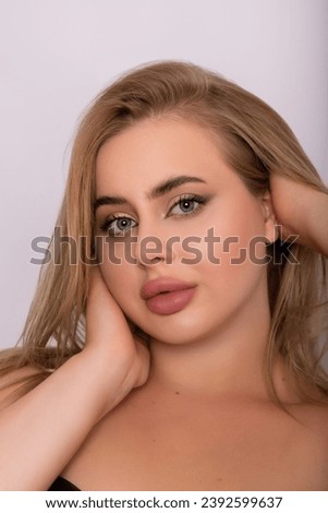 The face of a beautiful young blonde woman. Emotional portrait. High quality photo