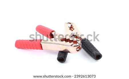 Copper battery terminals isolated on a white background. Car battery electrical clamps black and red. Electrical connectors. Royalty-Free Stock Photo #2392613073