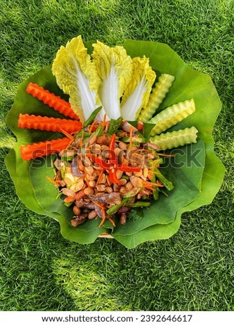 A plate of food that includes lettuce.