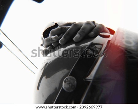 Pillion rider with a motorcycle bogo hat Royalty-Free Stock Photo #2392669977