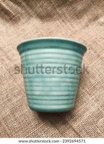 Vintage Old Pottery with Green Celadon Glass and Age Glaze Crazing Royalty-Free Stock Photo #2392694571