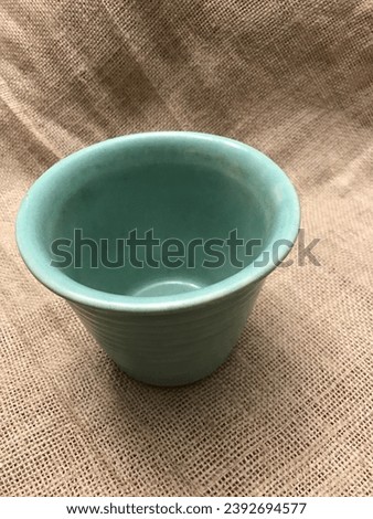 Vintage Old Pottery with Green Celadon Glass and Age Glaze Crazing Royalty-Free Stock Photo #2392694577
