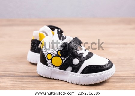 Sneakers Sports shoes with white soles. On a wooden background.
